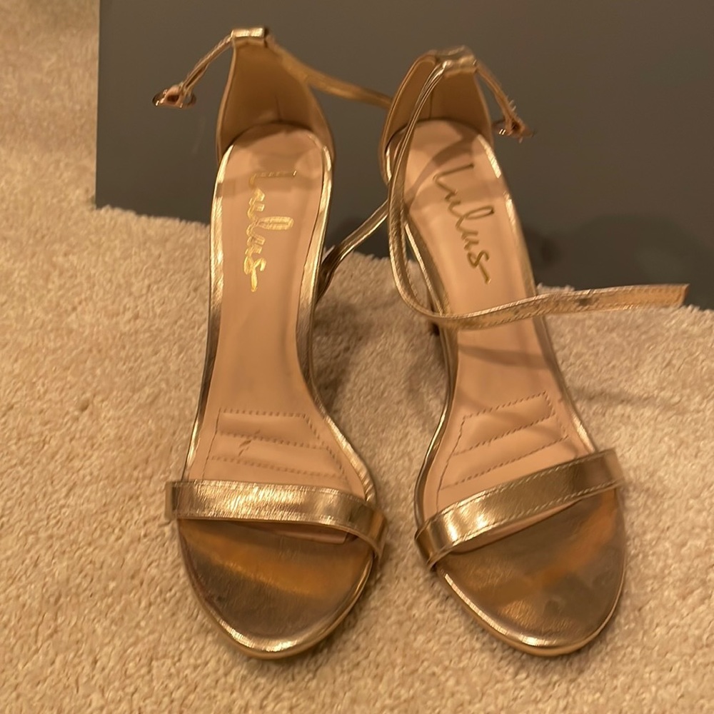 Gold open toe pumps